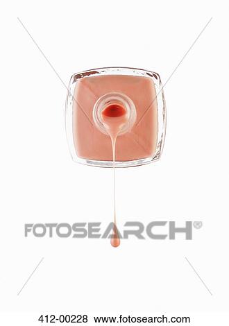 Close up of peach fingernail polish dripping from bottle View Large Photo Image Stock Photo - Close up of peach fingernail polish dripping from bottle. Fotosearch