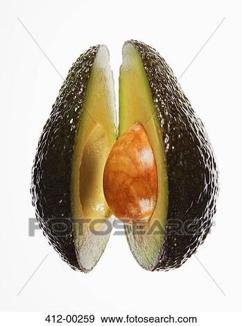 Close up of split avocado View Large Photo Image Stock Photo - Close up of split avocado. Fotosearch