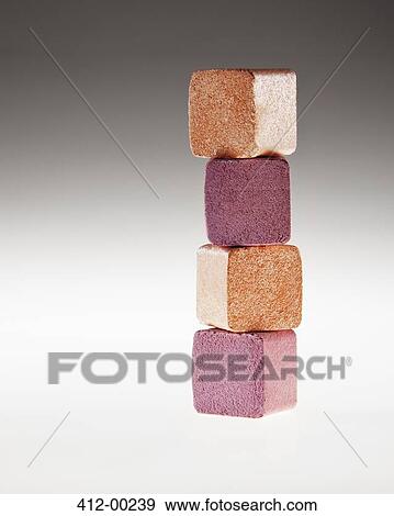 Close up of stacked gold and pink eyeshadow cubes View Large Photo Image Stock Photo - Close up of stacked gold and pink eyeshadow cubes. Fotosearch