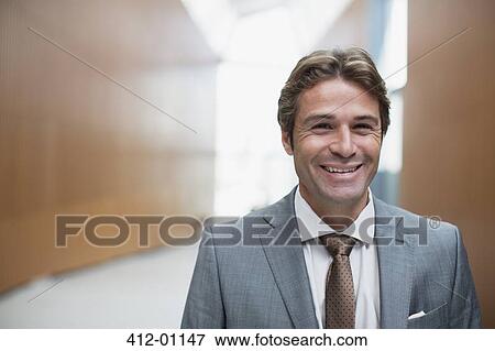 Stock Photo - Close up portrait of smiling businessman. Fotosearch