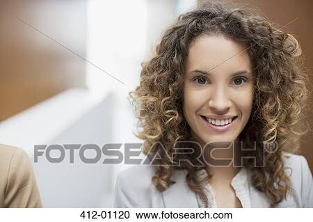 Stock Image - Close up portrait of smiling businesswoman. Fotosearch