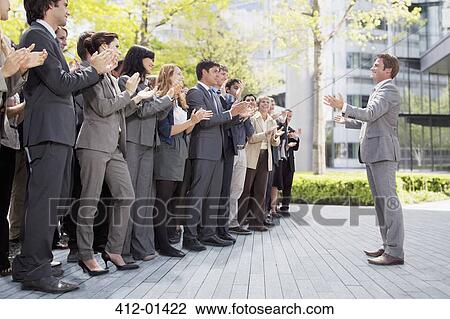 Crowd of business people cheering for businessman View Large Photo Image Stock Image - Crowd of business people cheering for businessman. Fotosearch