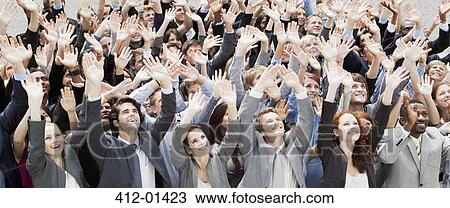 Crowd of business people cheering with arms raised View Large Photo Image Stock Image - Crowd of business people cheering with arms raised. Fotosearch
