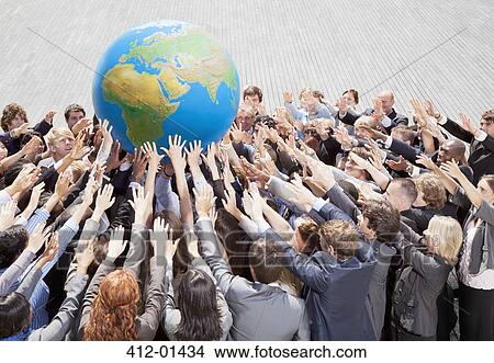 Crowd of business people reaching for globe View Large Photo Image Picture - Crowd of business people reaching for globe. Fotosearch