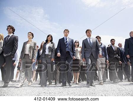 Stock Photo - Crowd of business people walking. Fotosearch