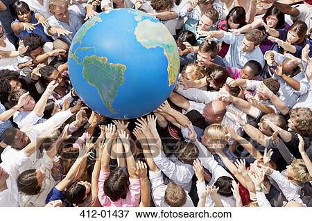 Stock Photo - Crowd of people reaching for globe. Fotosearch