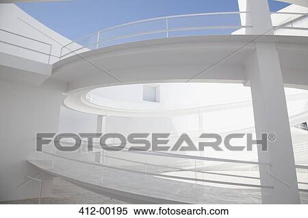 Curving elevated walkway in modern courtyard View Large Photo Image Stock Photography - Curving elevated walkway in modern courtyard. Fotosearch