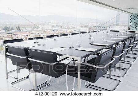 Stock Image - Empty conference room overlooking city. Fotosearch