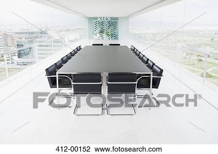 Empty conference room overlooking city View Large Photo Image Stock Image - Empty conference room overlooking city. Fotosearch