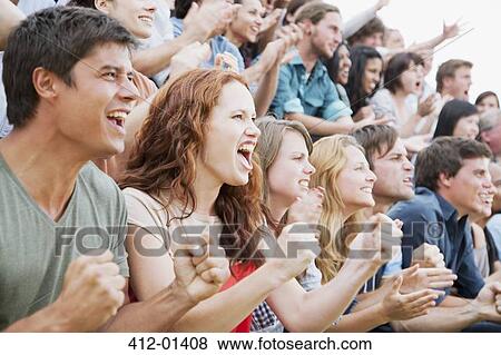 Fans cheering in crowd View Large Photo Image Stock Photo - Fans cheering in crowd. Fotosearch