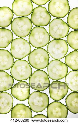 Stock Image - Full frame of cucumber slices. Fotosearch