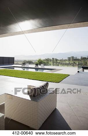 Luxury patio overlooking swimming pool View Large Photo Image Stock Image - Luxury patio overlooking swimming pool. Fotosearch