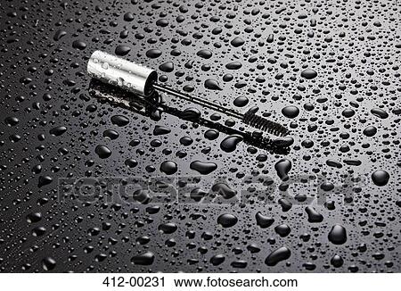 Mascara wand on wet background View Large Photo Image Stock Image - Mascara wand on wet background. Fotosearch