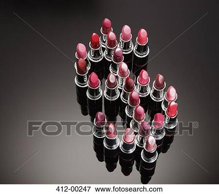 Multicolor lipsticks forming dollar sign View Large Photo Image Stock Photo - Multicolor lipsticks forming dollar sign. Fotosearch