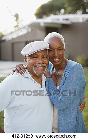 Stock Photo - Older couple smiling together outdoors. Fotosearch