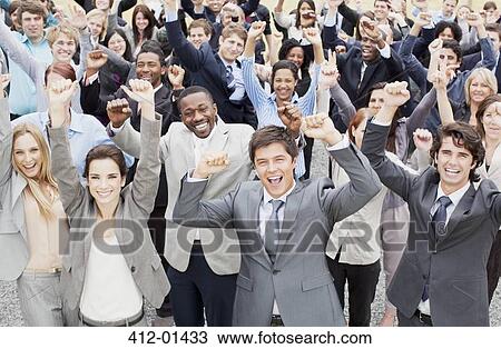 Portrait of business people cheering with arms raised in crowd View Large Photo Image Stock Image - Portrait of business people cheering with arms raised in crowd. Fotosearch