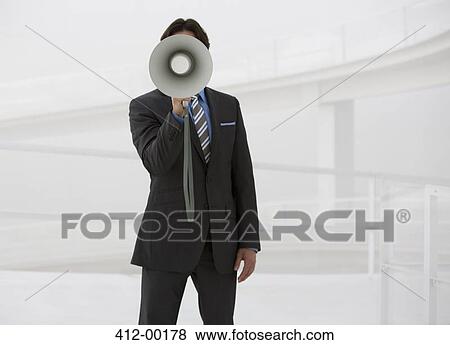 Portrait of businessman with bullhorn View Large Photo Image Stock Photo - Portrait of businessman with bullhorn. Fotosearch
