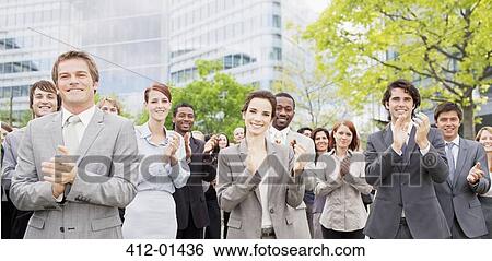 Portrait of clapping business people in crowd View Large Photo Image Stock Photograph - Portrait of clapping business people in crowd. Fotosearch