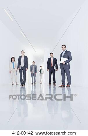 Portrait of confident business people in corridor View Large Photo Image Stock Image - Portrait of confident business people in corridor. Fotosearch