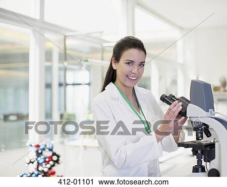 Portrait of confident scientist using microscope in laboratory View Large Photo Image Stock Image - Portrait of confident scientist using microscope in laboratory. Fotosearch