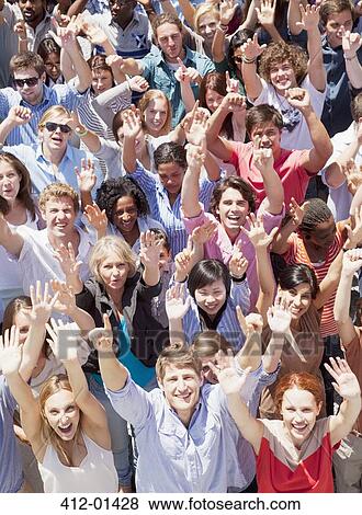 Portrait of crowd cheering with arms raised View Large Photo Image Stock Photo - Portrait of crowd cheering with arms raised. Fotosearch