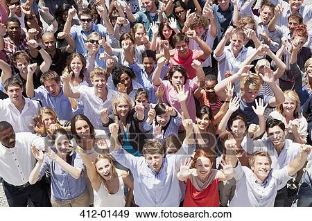 Portrait of crowd cheering with arms raised View Large Photo Image Stock Photo - Portrait of crowd cheering with arms raised. Fotosearch