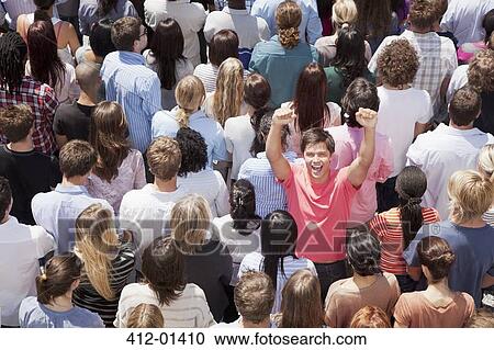 Portrait of enthusiastic man cheering in crowd View Large Photo Image Stock Image - Portrait of enthusiastic man cheering in crowd. Fotosearch