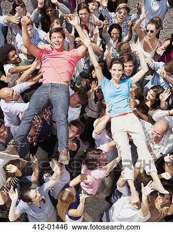 Portrait of man and woman crowd surfing View Large Photo Image Stock Photograph - Portrait of man and woman crowd surfing. Fotosearch