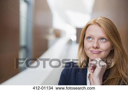 Portrait of pensive businesswoman looking up View Large Photo Image Picture - Portrait of pensive businesswoman looking up. Fotosearch