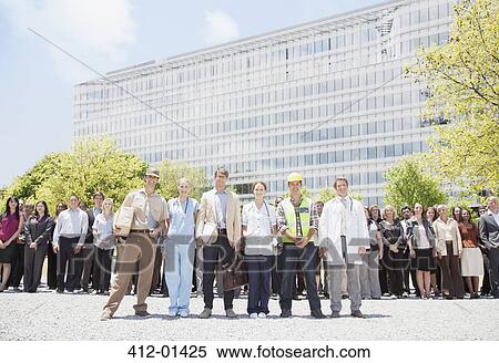 Portrait of professionals and workers with crowd of business people in background View Large Photo Image Stock Photography - Portrait of professionals and workers with crowd of business people in background. Fotosearch