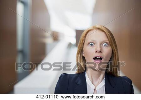 Stock Image - Portrait of shocked businesswoman. Fotosearch