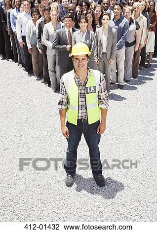 Portrait of smiling construction worker with business people in background View Large Photo Image Stock Image - Portrait of smiling construction worker with business people in background. Fotosearch