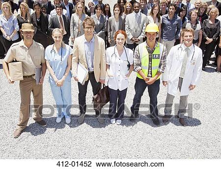 Portrait of smiling professionals and workers with business people in background View Large Photo Image Stock Image - Portrait of smiling professionals and workers with business people in background. Fotosearch