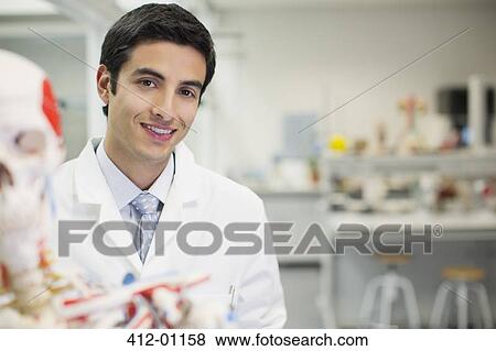 Portrait of smiling scientist with anatomical model n laboratory View Large Photo Image Stock Photo - Portrait of smiling scientist with anatomical model n laboratory. Fotosearch
