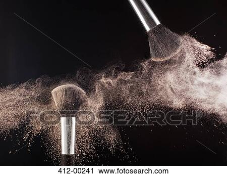 Powder blowing from makeup brushes View Large Photo Image Stock Image - Powder blowing from makeup brushes. Fotosearch