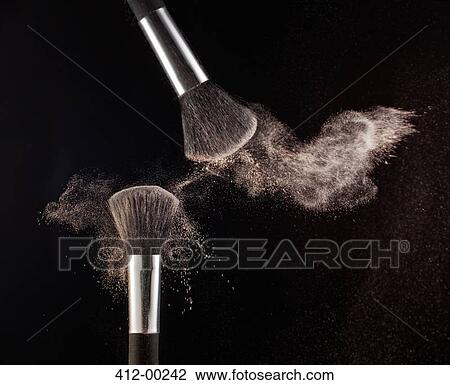 Powder blowing from makeup brushes View Large Photo Image Stock Image - Powder blowing from makeup brushes. Fotosearch