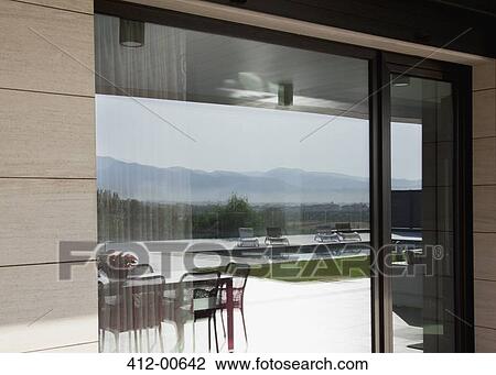 Reflection of swimming pool in patio door View Large Photo Image Stock Image - Reflection of swimming pool in patio door. Fotosearch