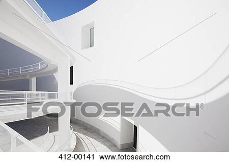 Shadow of curving elevated walkway on sunny wall View Large Photo Image Stock Image - Shadow of curving elevated walkway on sunny wall. Fotosearch