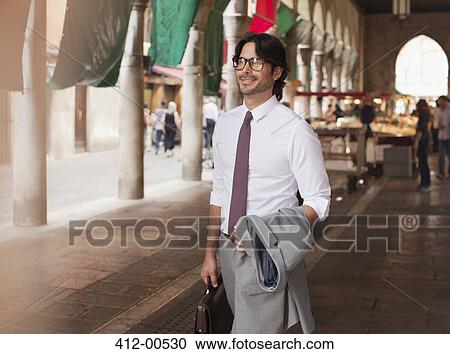 Smiling businessman at outdoor market n Venice View Large Photo Image Stock Image - Smiling businessman at outdoor market n Venice. Fotosearch
