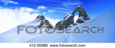 Snow covered craggy mountain View Large Photo Image Stock Photograph - Snow covered craggy mountain. Fotosearch