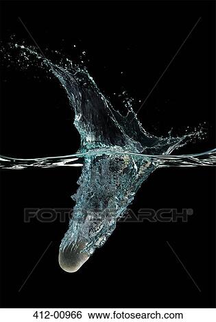Stone dropping into water View Large Photo Image Stock Photograph - Stone dropping into water. Fotosearch