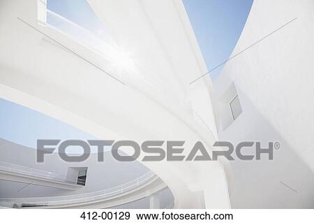 Sun shining behind elevated walkway View Large Photo Image Stock Photo - Sun shining behind elevated walkway. Fotosearch