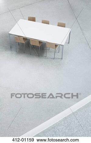 Table and chairs in empty lobby View Large Photo Image Stock Photo - Table and chairs in empty lobby. Fotosearch