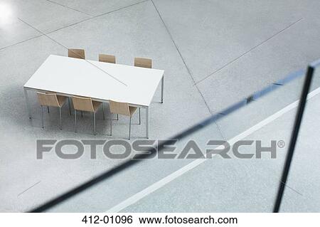 Table and chairs in empty lobby View Large Photo Image Stock Photograph - Table and chairs in empty lobby. Fotosearch