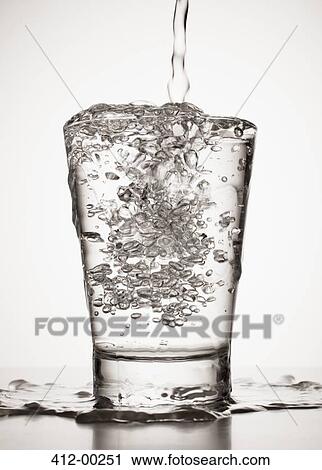 Water overflowing from glass View Large Photo Image Stock Image - Water overflowing from glass. Fotosearch