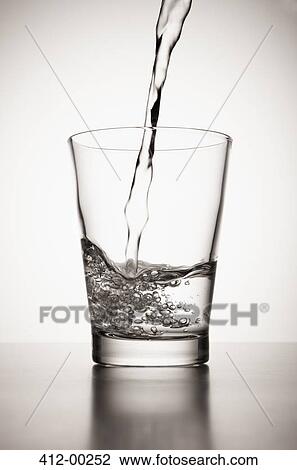 Water pouring into glass View Large Photo Image Stock Image - Water pouring into glass. Fotosearch