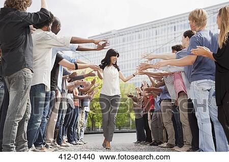 Woman touching hands of fans in crowd View Large Photo Image Stock Image - Woman touching hands of fans in crowd. Fotosearch