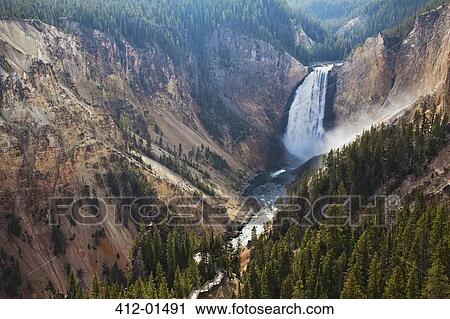 Stock Image - Aerial view of waterfall in rocky canyon. Fotosearch