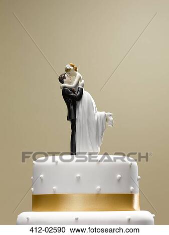 Bride and groom topper on wedding cake View Large Photo Image Stock Image - Bride and groom topper on wedding cake. Fotosearch