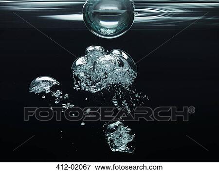 Bubbles floating underwater View Large Photo Image Stock Photo - Bubbles floating underwater. Fotosearch